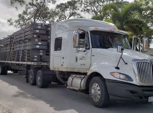 Truck transporting prefabricated steel building kits