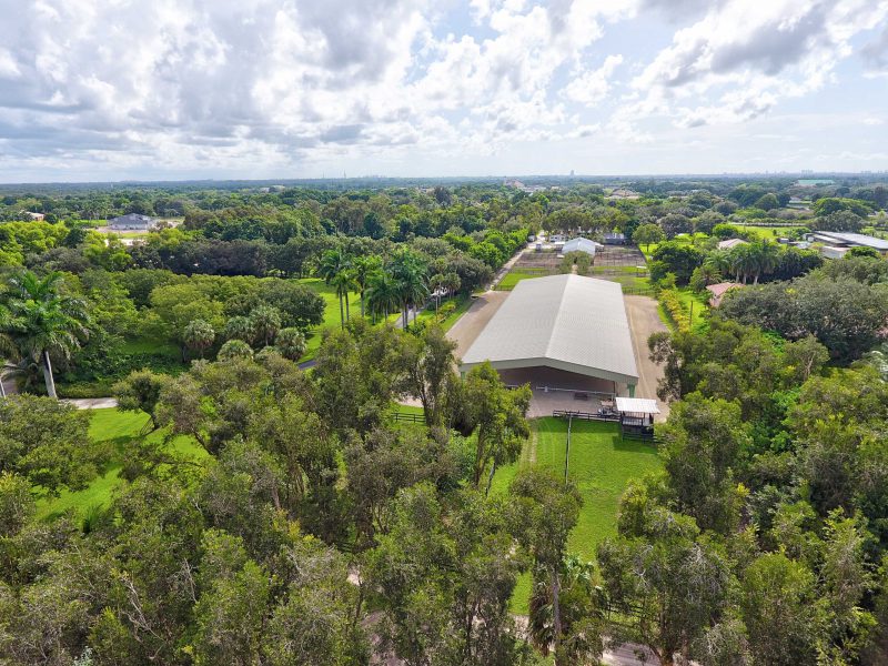 Aerial shot of 80‘ x 210‘ x 16‘ metal construction for covered riding arena