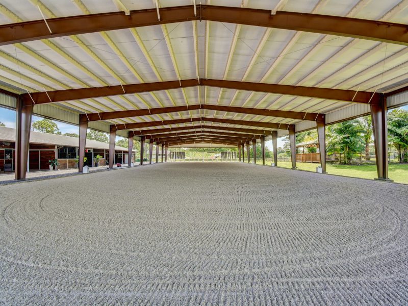 Customizable covered riding arena allows for open riding and training space