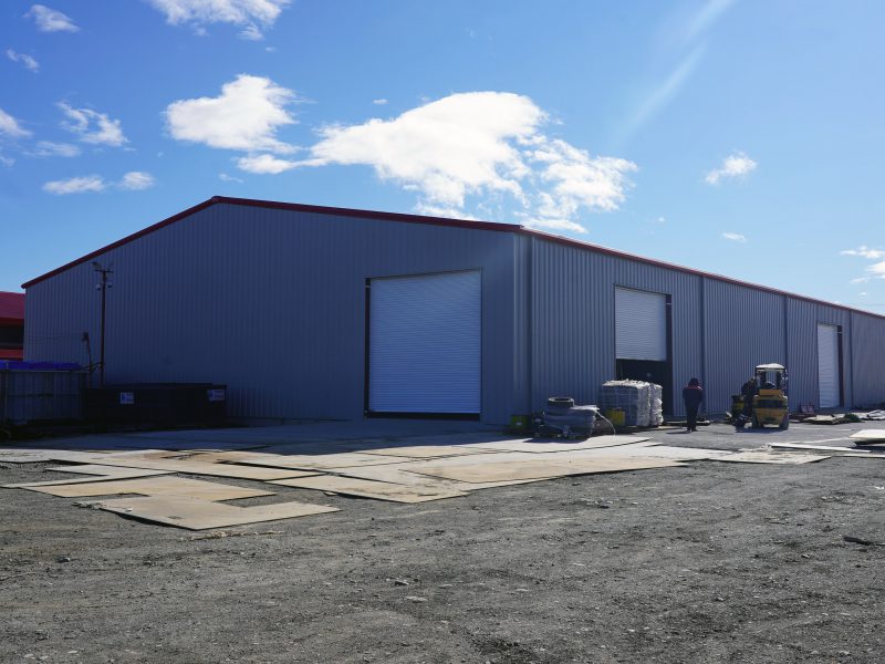 Allied metal building kits for Punta Arenas, Chile-located storage warehouse with framed openings for doors and overhead doors