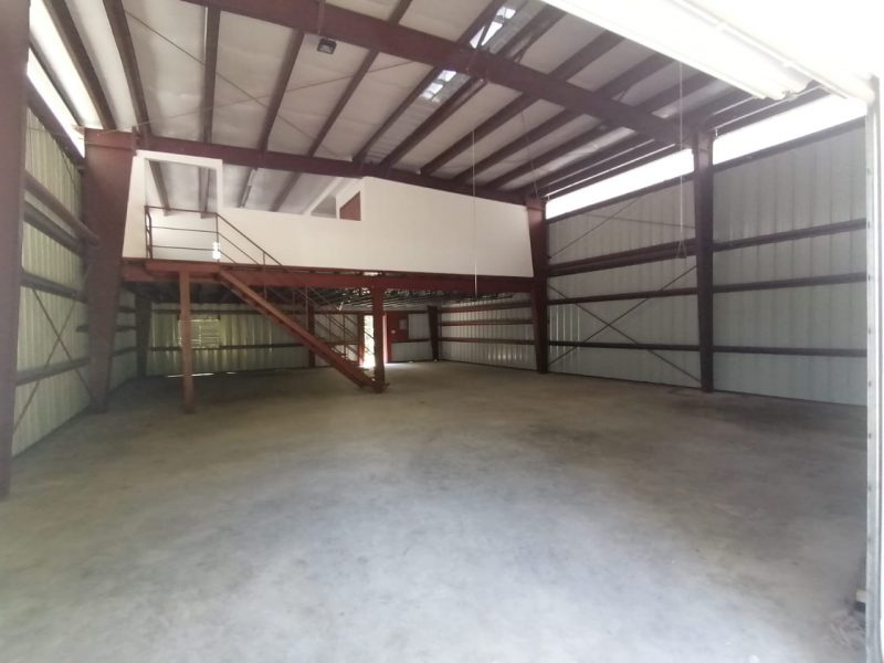 Interior of a metal building office with 40x60 build-out, 24x40 mezzanine and braided cable bracing