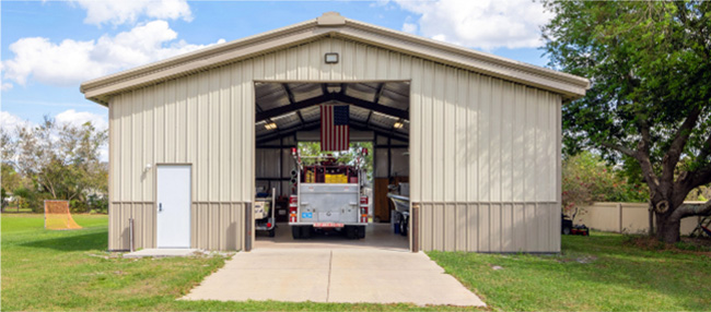 40x50x12 Tan gable steel building garage kit with wainscott, walk door, and overhead door.