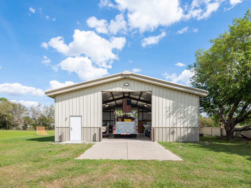 40x50 Metal Building, 40x50x12 Tan gable steel building garage kit with wainscott, walk door, and overhead door.