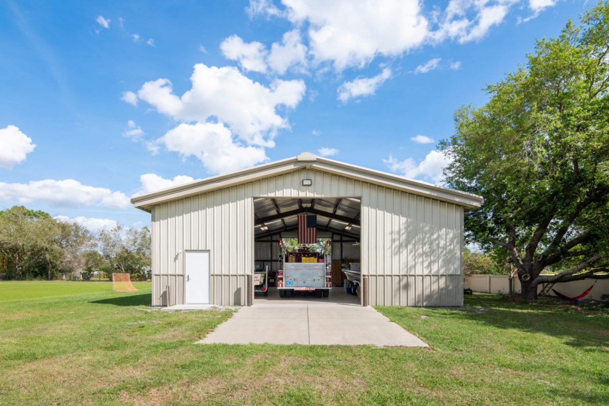 40x50 Metal Building, 40x50x12 Tan gable steel building garage kit with wainscott, walk door, and overhead door.